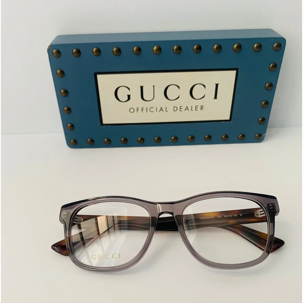 Gucci's GG0004ON features soft lines frames acetate front. Iconic web effect